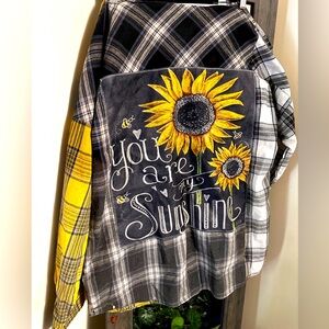 Multicolored oversized flannel with you are my sunshine embroidered.